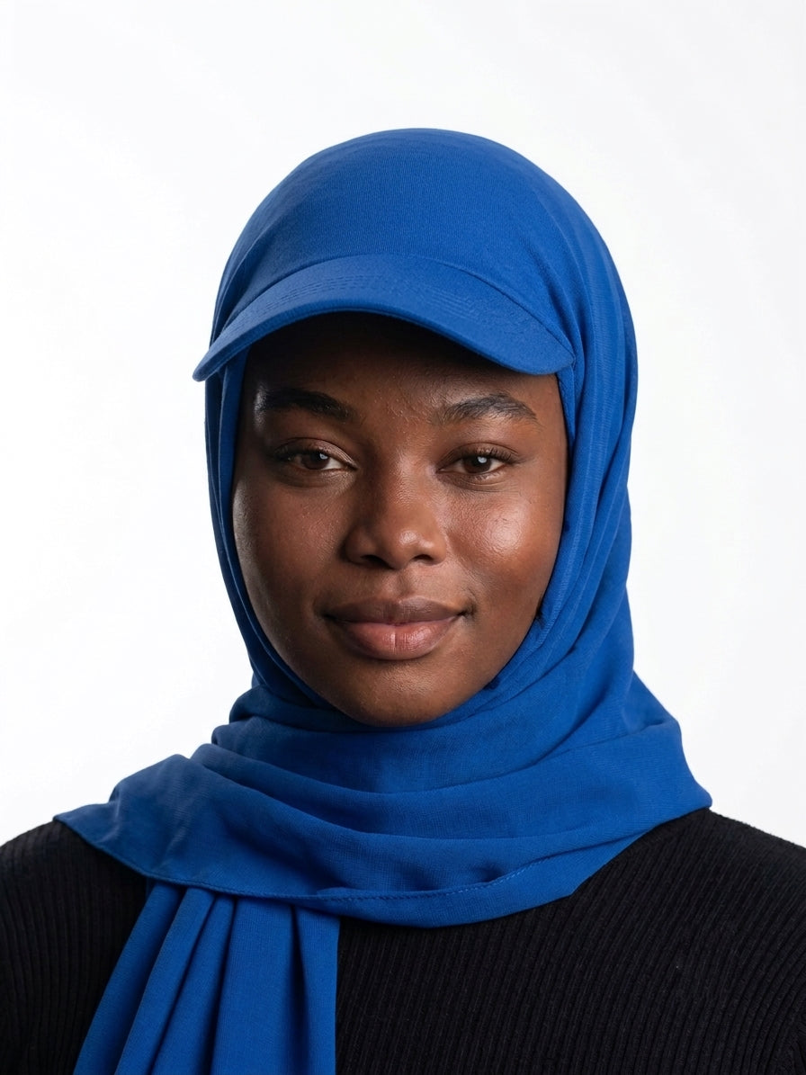Woman wearing a royal blue Baseball Cap Hijab Scarf with built-in cap brim