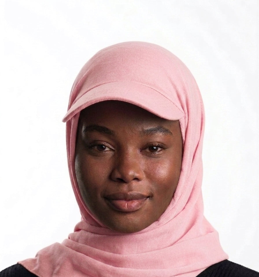 Woman wearing a baby pink Baseball Cap Hijab Scarf, soft instant hijab