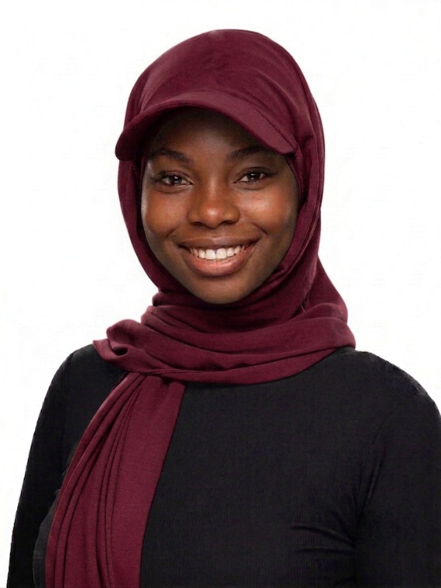 Woman wearing a wine-colored Baseball Cap Hijab Scarf with built-in cap brim