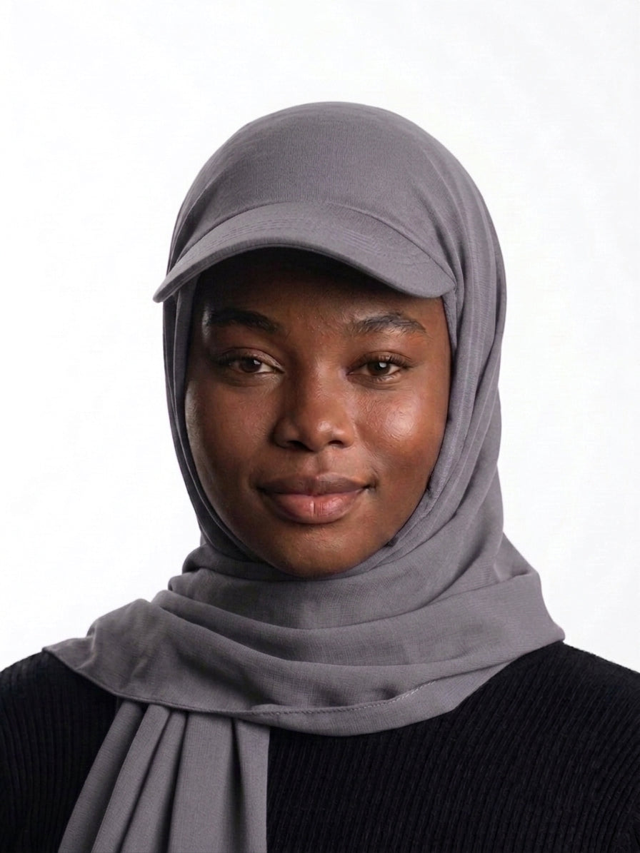 Woman wearing an ash grey Baseball Cap Hijab Scarf by Head and Extra
